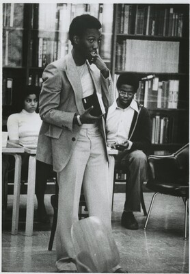 Jon Williams '80 stands front of the Black Library for a Poetry reading during Black Martyrs weekend in 1978. Terri Tiddle '79 and Tony Whitaber '80 are in the background. The Black Library became a space for events that featured Black scholarship and excellence.
