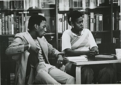 Jon Williams '80 and Julie Rogers '80 sit in front of the Black Library for a Poetry reading. The Black Library became a space for events that featured Black scholarship and excellence.