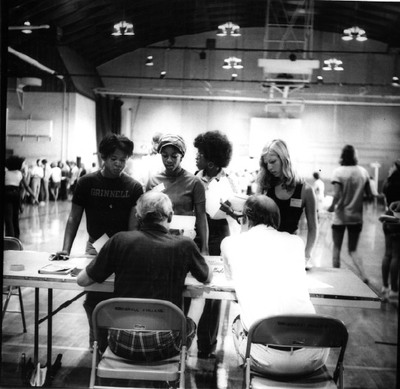Four students wait for information. The Black Manifesto’s stated that “We demand that this administration establish a Black community with no less that 200 representatives taken from all walks of life of Black people, and that the responsibility of for the establishment of this community be co-shared by the present black community.”