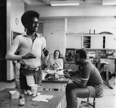 Photo of Allen S. Hammond '72 and Duane T. Taylor '73. This photo, and other Black Expressions photos were in a brochure CBS created to let prospective Black students what to expect from Grinnell College. The Black Manifesto’s stated that “We demand that this administration establish a Black community with no less that 200 representatives taken from all walks of life of Black people, and that the responsibility of for the establishment of this community be co-shared by the present black community.”
