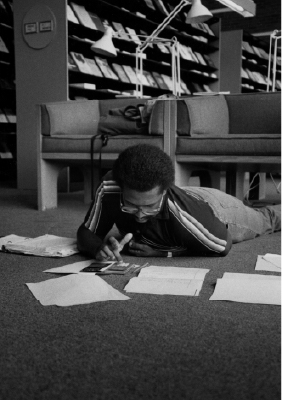 Photo of a student doing math homework in Burling Library.