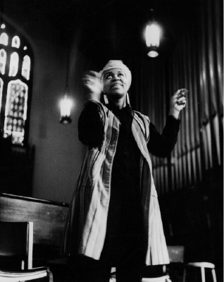 Val Gray Ward speaking at Grinnell’s third Black Martyr's Weekend. Celestine Bloomfield ‘71 wrote in the Scarlet and Black student newspaper that Ward gave a “stirring rendition of James Weldon Johnson's The Creation”. The 1971 Black Martyr's Weekend featured a full schedule including a “Soul Food Bazaar”, film screenings of “The Olive Tree of Justice” and “Viridiana”, a concert by The Impressions, Poetry and dramatic readings by actress Val Gray Ward, a lecture by Black nationalist Christian minister The Rev. Albert B. Cleage, Jr.,  a performance of "The Lion Writes” by the Cleveland theater group The Karamu Players, a performance by CBS, and a lecture with activist and comedian Dick Gregory.  Gregory ended his lecture with the quote:”You have the all-important job of returning sanity to an insane society … The . . . thing you young folks have that scares us old folks is your moral force.” (S&B April 9, 1971 pg 3).  Cleage focus his lecture on the stages of revolution, stating that “First, you cry out. Then you hit at the nearest point of irritation”(S&B April 9, 1971 pg 3). 